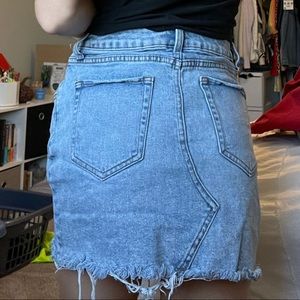 Distressed denim mini skirt